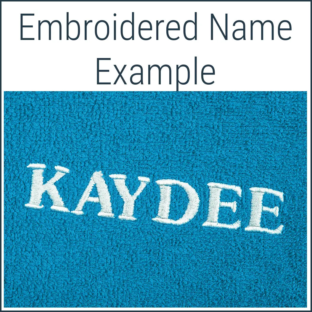 Close-up of a teal Dogrobe MAX dog drying robe personalised with an embroidered name in white thread