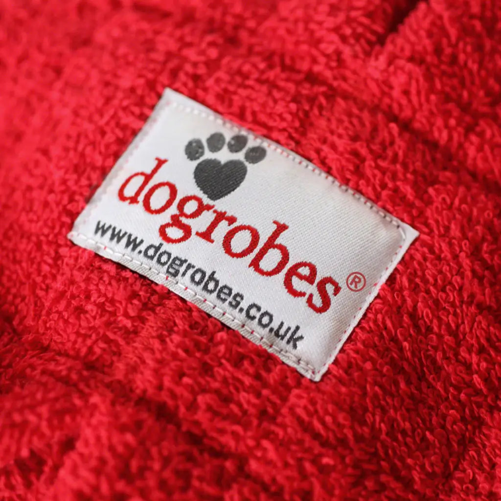 Dogrobes label with trademark stitched onto unique dual-loop red towelling fabric