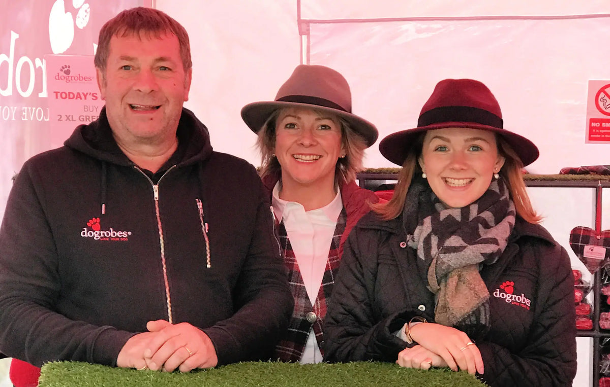 Dogrobes family team at event promoting British-made dog drying coats, Snoods and drying mitts