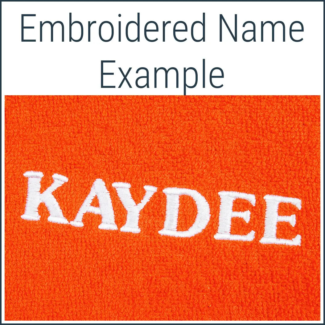 Close-up of an orange Dogrobe MAX dog towelling robe personalised with an embroidered name in white thread