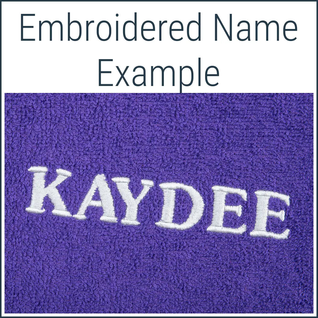 Close-up of a purple Dogrobe MAX dog towel robe personalised with an embroidered name in white thread