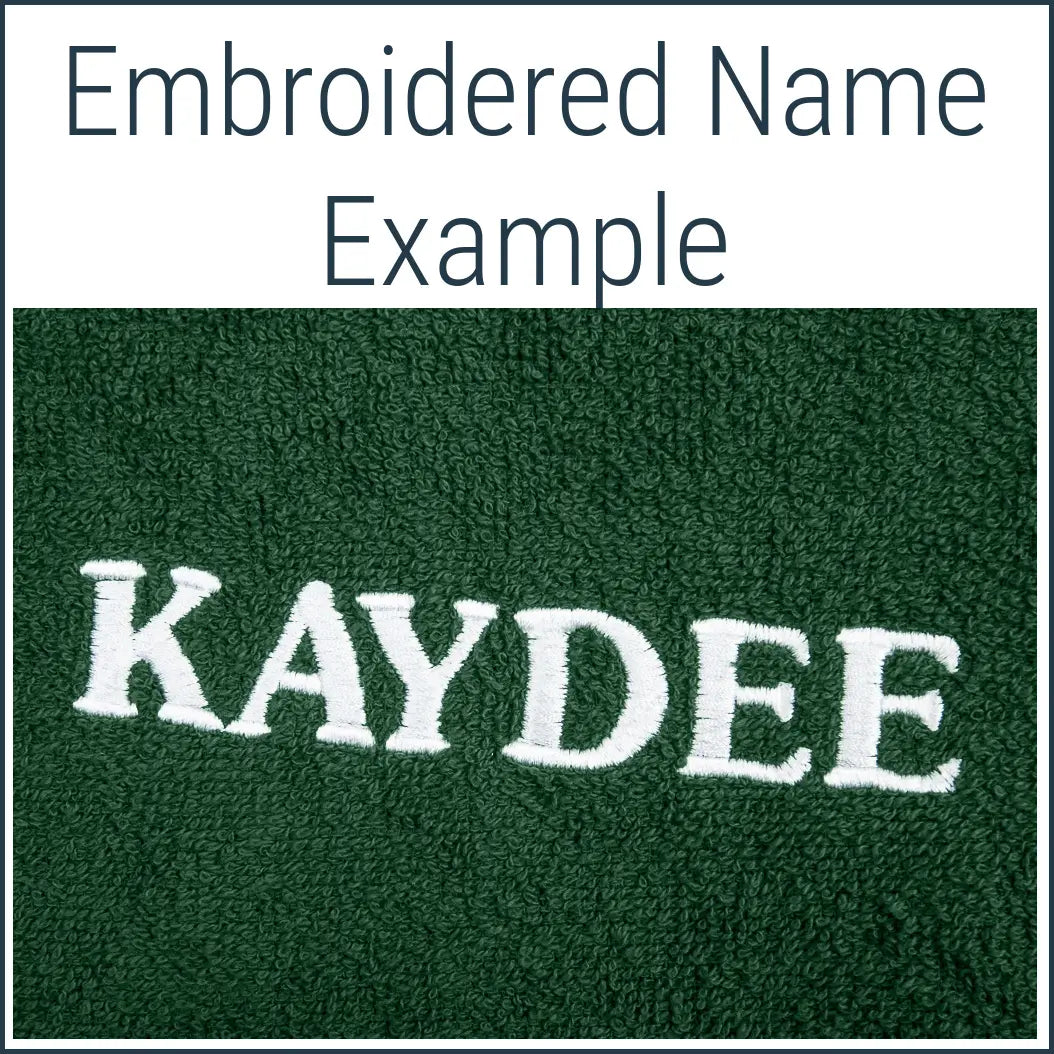 Close-up of a green Dogrobe MAX dog drying robe personalised with an embroidered name in white thread