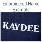 Close-up of a navy Dogrobe MAX dog drying robe personalised with an embroidered name in white thread