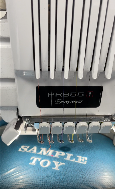 Video showing a personalised Dogrobe being embroidered from hooping and stitching to the finished result