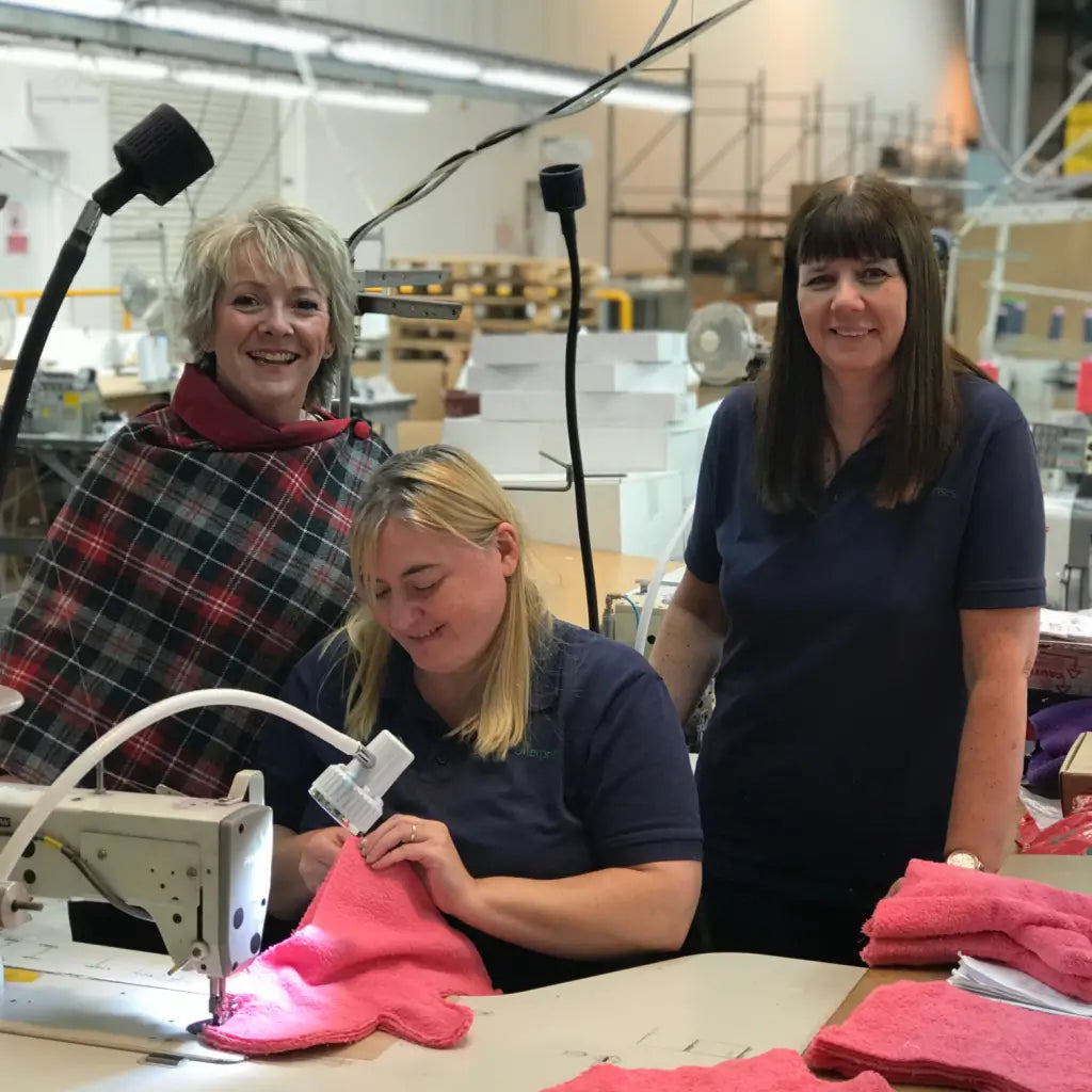 Margaret, owner of Dogrobes with skilled machinists making Dogrobes dog drying products