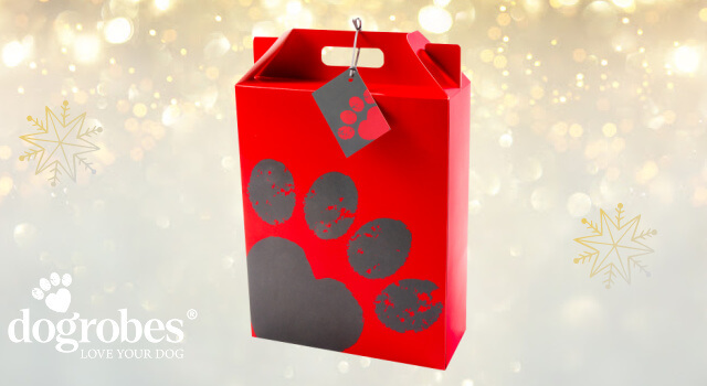 Dogrobes’ gift box shown as festive packaging. A tall red box with a grey paw print and a matching gift tag with grey ribbon.