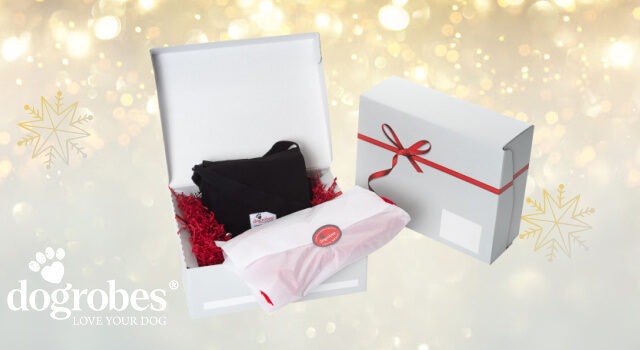 Gift wrap box with red sizzle pack. Gifts wrapped in branded tissue paper secured with a genuine Dogrobes’ product sticker.