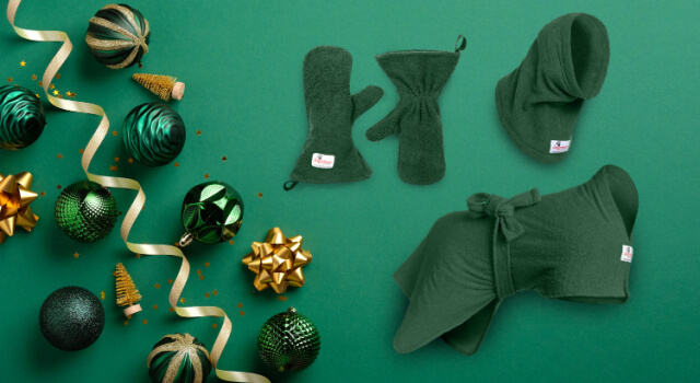 Complete The Kit - A Green Dogrobe, Snood and Gauntlets on a green background with Christmas baubles