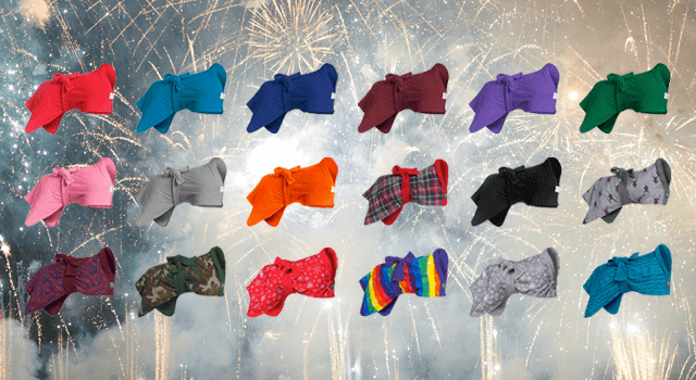 Dogrobes’ dressing gowns for dogs in ten colours against fireworks background.