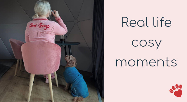 Woman in pink Good Morning pyjamas and her dog wearing a teal Dogrobe enjoying a real life cosy morning moment