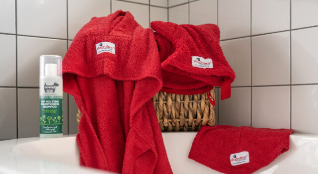 red-dogrobe-snood-gauntlets-bathroom-winter-drying-kit Red Dogrobe Snood and Gauntlets drying in a bathroom, ready for winter walks and bath time care
